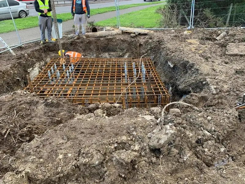Steel reinforcement fixed in an excavation ready for a concrete base