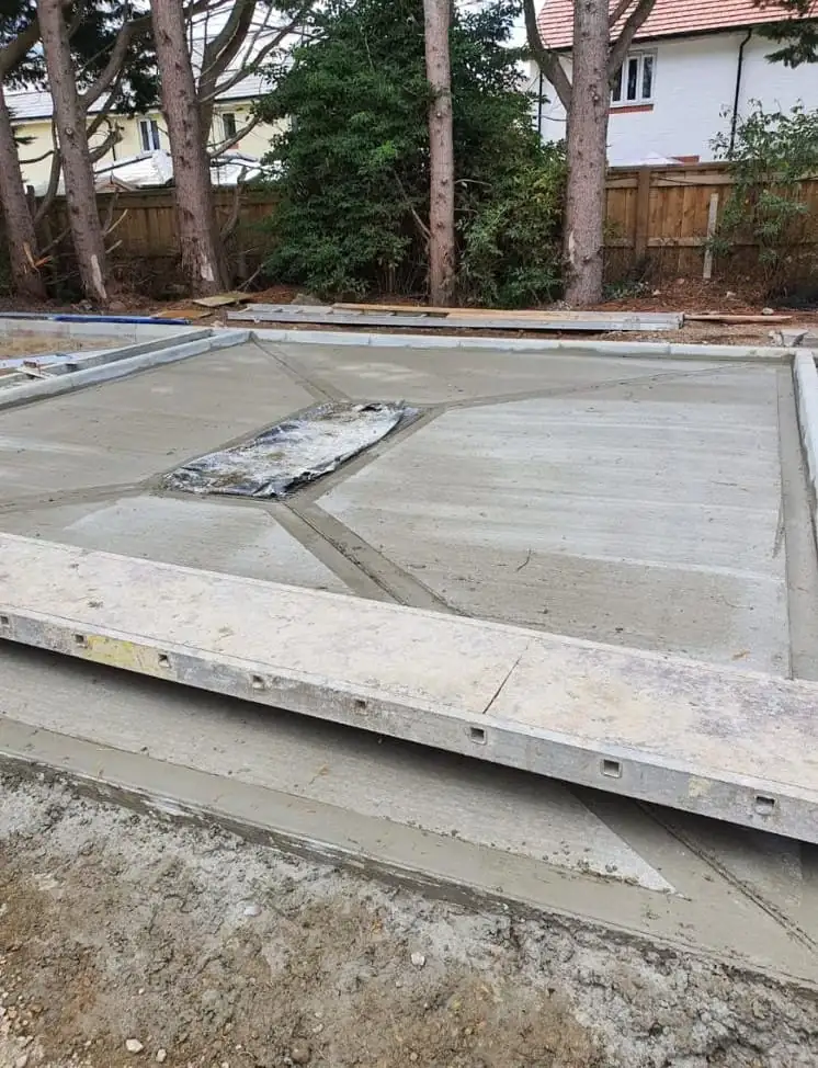New concrete slab with a channel drain set along its edge