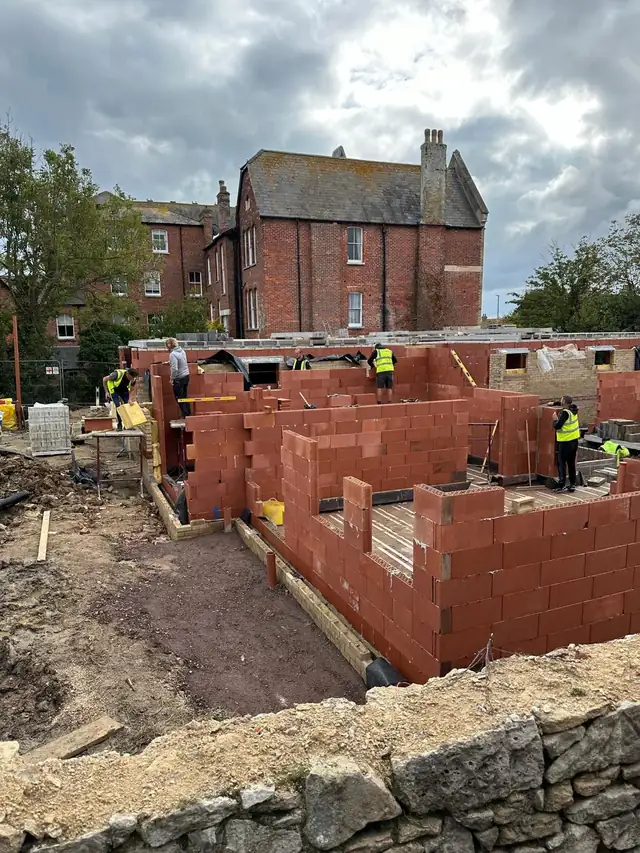 Red Porotherm block walls going up on the Dorchester Road flats in Weymouth